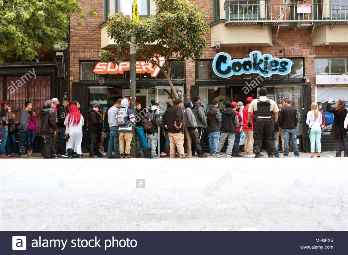 A Very Long Line Of People Waits To Get Into A New Cookies Store